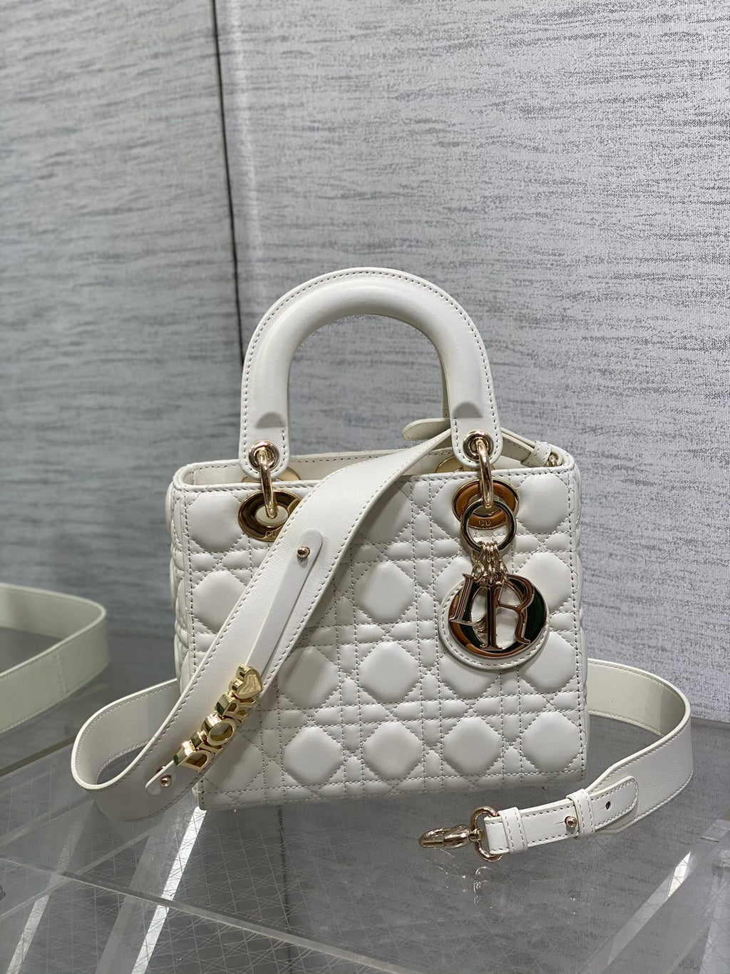 Dior White Quilted Leather Handbag with Gold Charms and Wide Strap